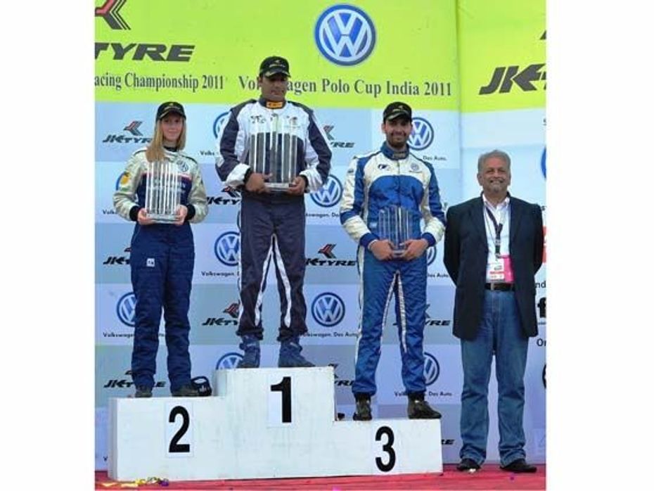 (L-R)Winners of Race Two of Round Six of the Vokswagen Polo R Cup 2011 - Maiken Rasmussen, Sunny Sidhu and Mihir Dharkar with Dr. John Chacko the podium