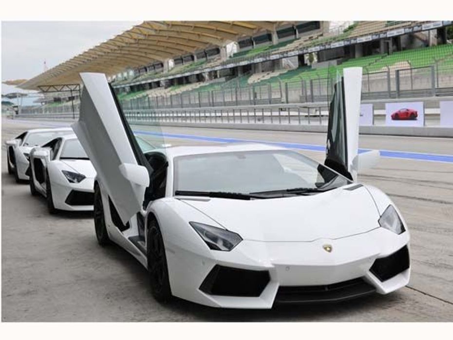 Three Lamborghini Aventadors line up at the Sepang International test track in Malaysia