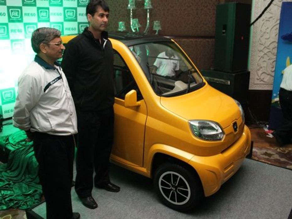 Bajaj Auto CEO, Rajeev Bajaj poses with the new Bajaj RE60 in Delhi