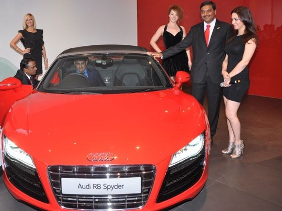 Audi Bhopal showroom opening - Mr. Gaurav Anand, Managing Director, Audi Bhopal (Anand Cars Private Ltd) sitting insise Audi R8 Sypder and Nauheed Cyrusi
