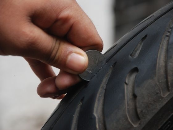 Checking Tyre Tread with one rupee coin