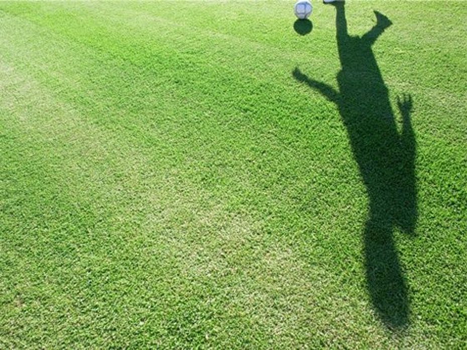 Shadow of footballer