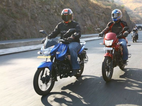 Honda Dream Yuga and Bajaj Discover 100T in action Honda Dream Yuga and Bajaj Discover 100T in action