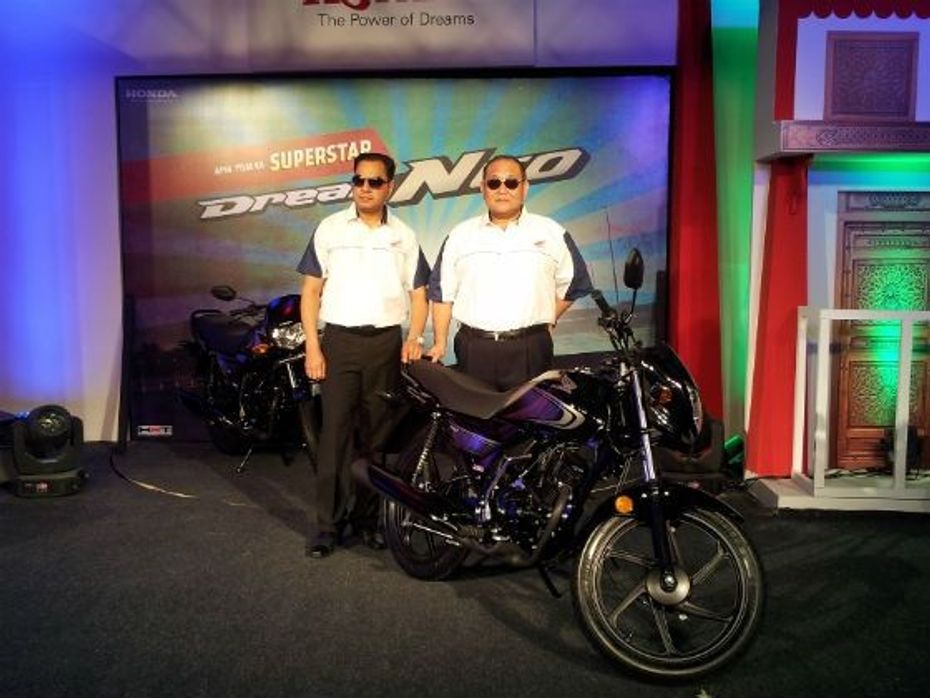 Honda official posing with the Dream Neo at launch