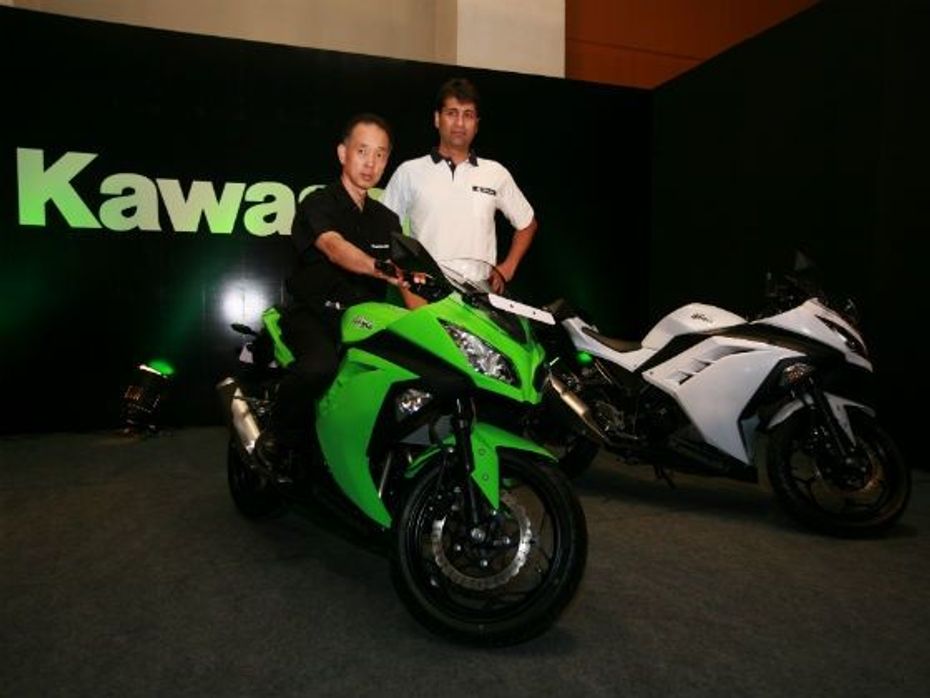 Kawasaki official and Rajiv Bajaj pose with the Ninja 300
