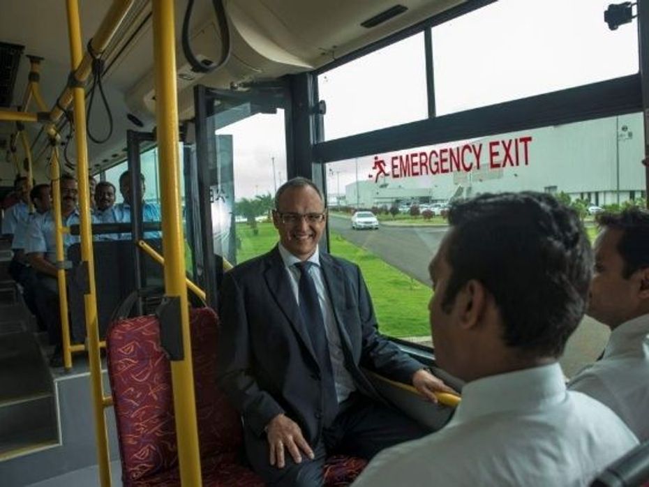Eberhard Kern onboard city bus with employees