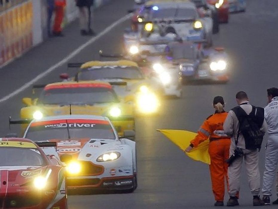 Allan Simonsen of Denmark (2nd L) drives his Aston Martin Vantage V8 at the start of the Le Mans 24-hour sportscar race