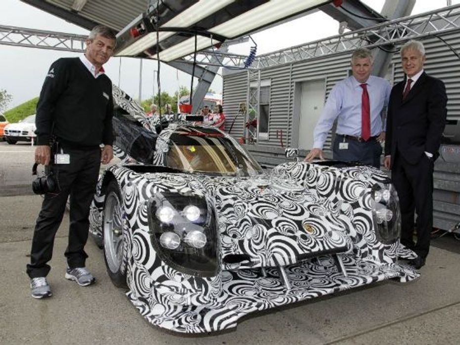 Fritz Enzinger, Wolfgang Hatz, and Matthias Muller, with the  Porsche LMP1 prototype