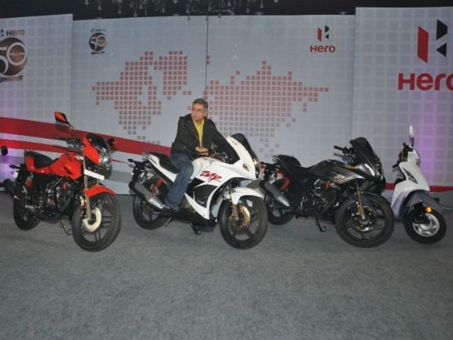 Pawan Munjal poses with the new range of bikes