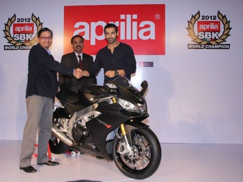 John Abraham with Piaggio officials at the Aprilia RSV4 handing over ceremony