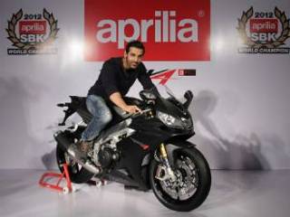 John Abraham receives Aprilia RSV4 from Piaggio