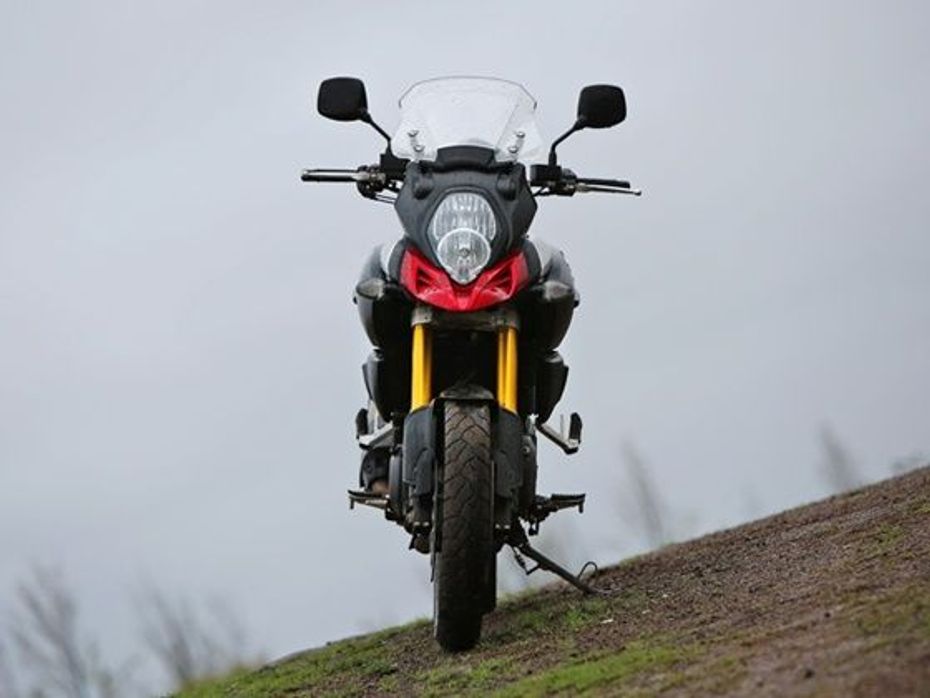 Suzuki V-Strom red motorcycle on a hill