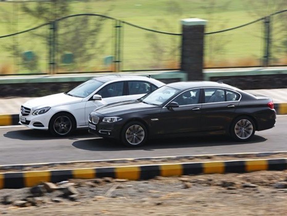 BMW 5 Series & Merc E-Class driving shot