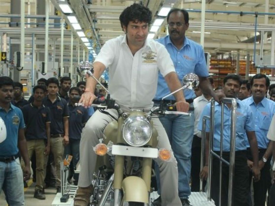 Siddhartha Lal riding the first motorcycle to be produced in the Orgadam facility