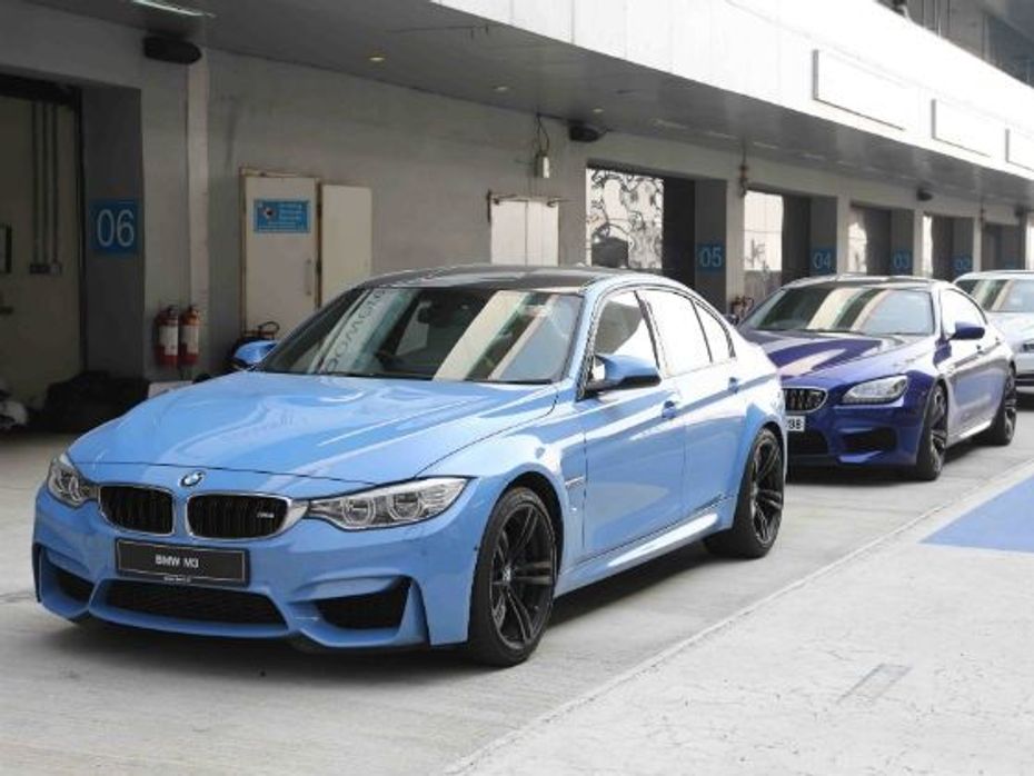 BMW M4 lined up in the pit lane