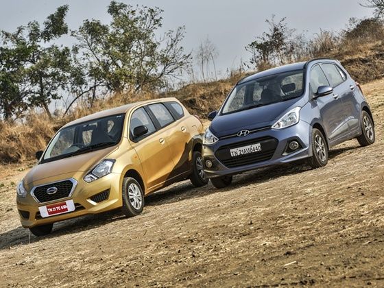 Datsun Go Plus vs Hyundai Grand i10 Petrol Comparison Review front Datsun Go Plus vs Hyundai Grand i10 Petrol Comparison Review front