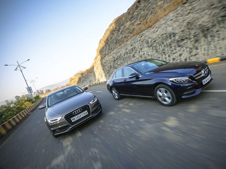 Mercedes-Benz C-Class vs Audi A4 front tracking shot