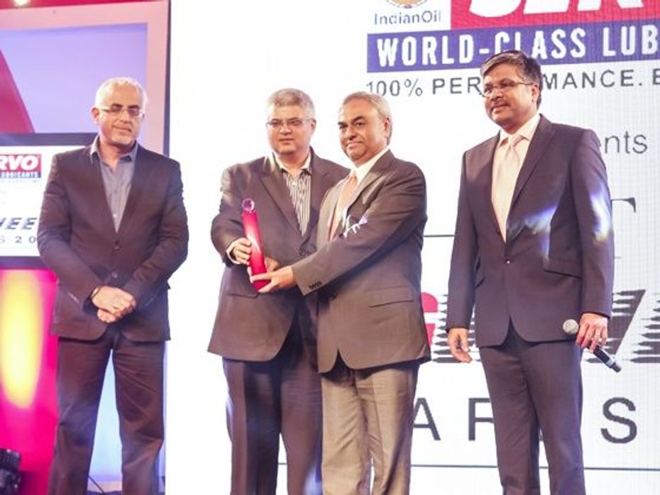 SUV of the year award received by Pravin Shah for the Mahindra Scorpio
