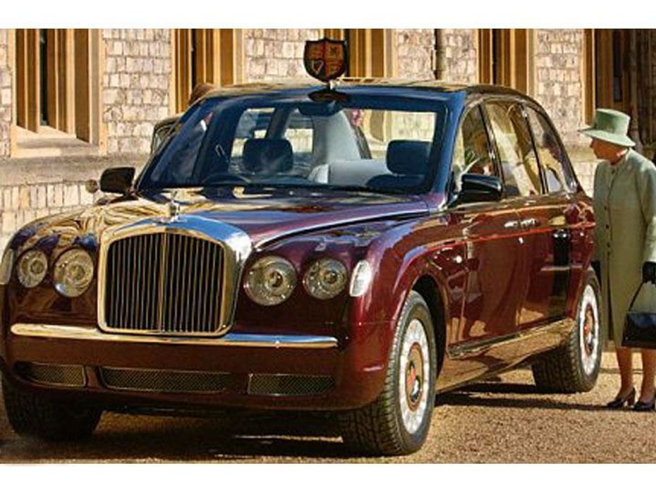 Queen Elizabeth II besides her Bentley Limousine