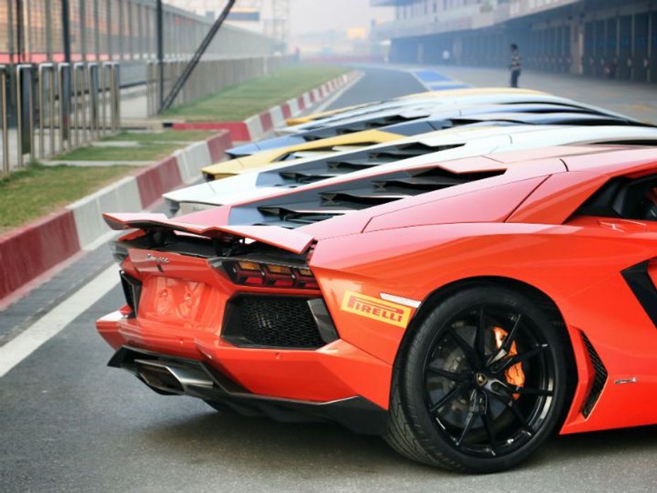 Lamborghini Aventadors lined up in the pit lane