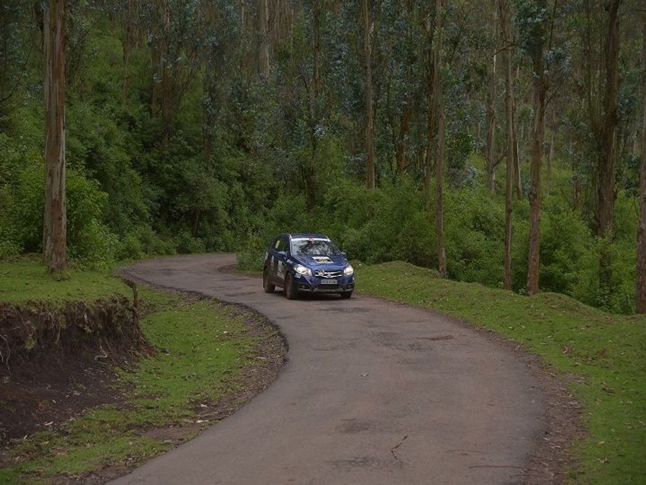 A participant makes way through the forest during the Maruti Suzuki National Super League TSD Rally Championship