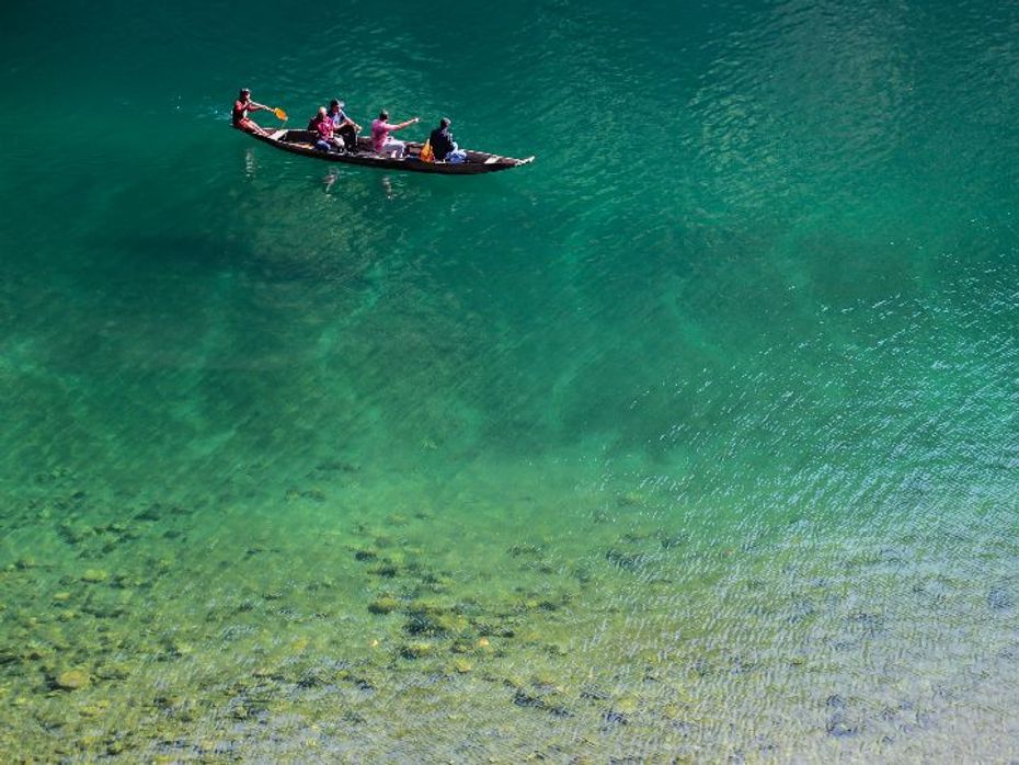 Floating in the air. The clear waters of the Dawki river