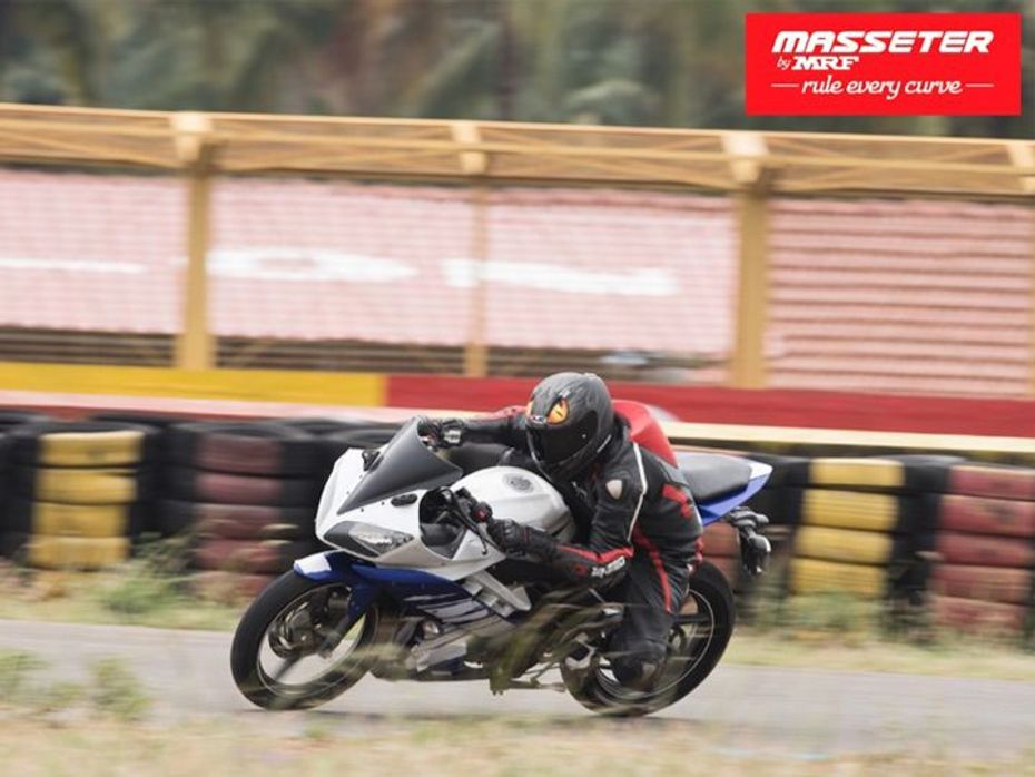 Seasoned rider cornering on a Yamaha R-15 fitted with MRF Masseter tyres