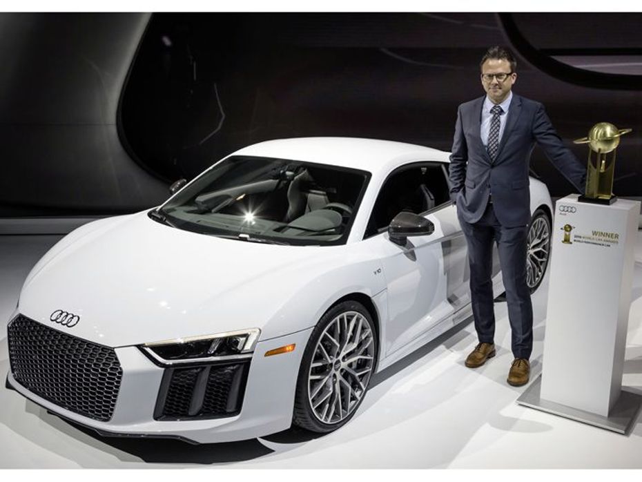 Roland Schala, Audi R8 Project Manager, with the R8 Coupé and the “2016 World Performance Car” award