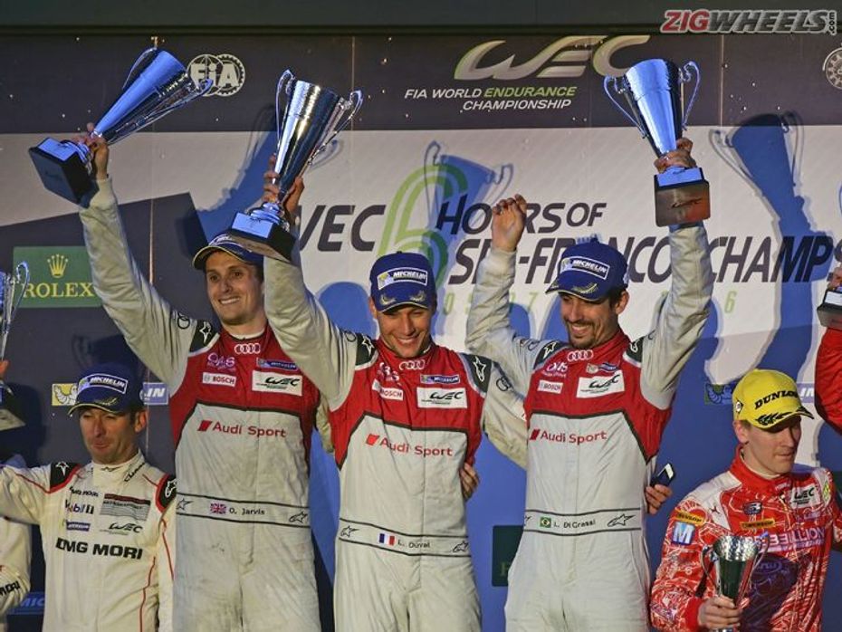 Drivers of car number 8 of Audi Sport team celebrating podium victory at 2016 WEC