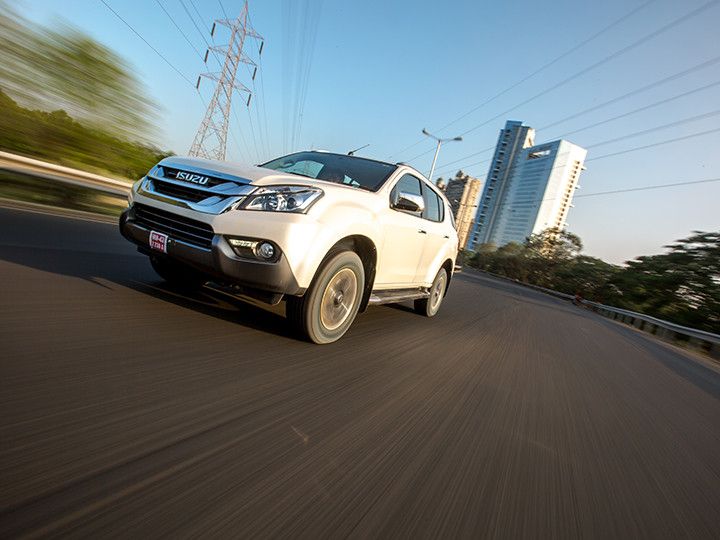 Isuzu MU-X driving on the road Isuzu MU-X driving on the road