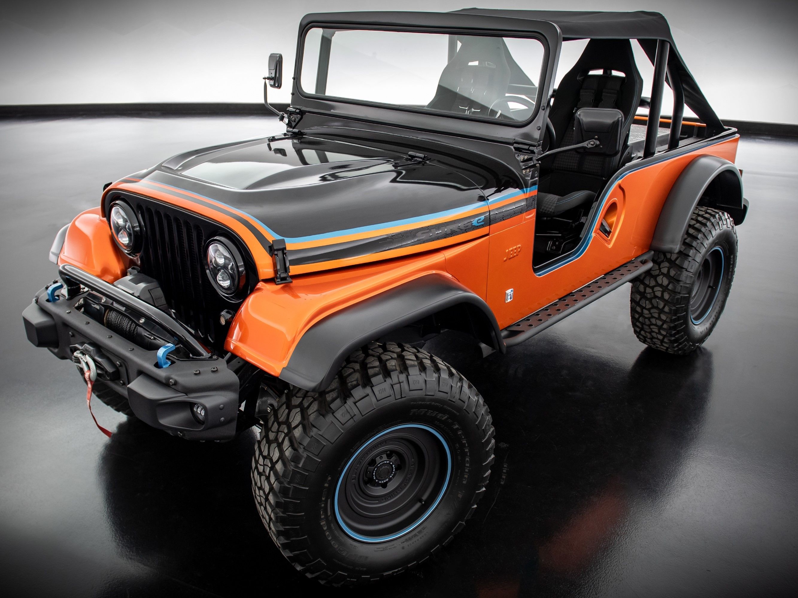 Jeep CJ Surge Concept Revealed At SEMA As An All-electric Retro 4x4  Modified For Off-roading - ZigWheels