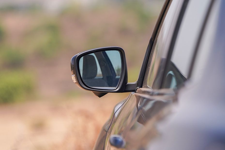 Side mirror rear angle Image of Dzire