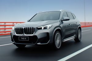 Driving: Front Left Quarter View Image of X1 LWB