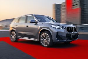 Driving: Front Right Quarter View Image of X1 LWB