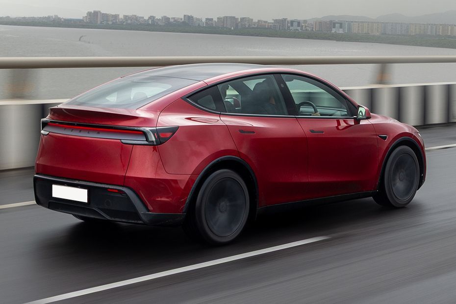 Driving: Rear Right Three Quarter View Image of Model Y