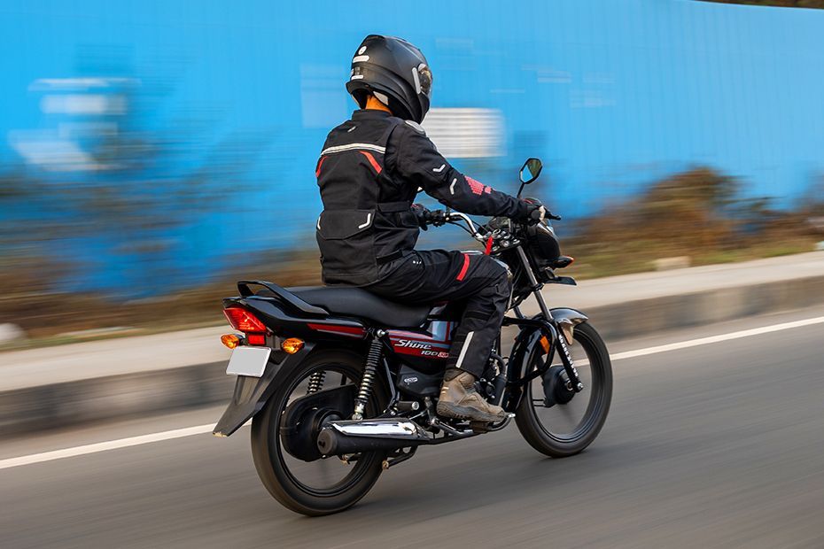 Riding: Rear Right 3/4 View of Shine 100 DX
