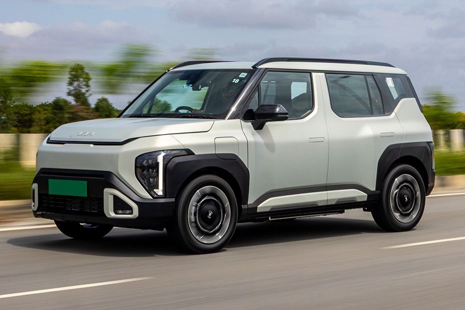 Driving: Front Left Quarter View Image of Syros EV