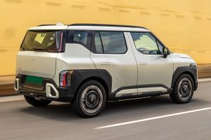 Driving: Rear Right Three Quarter View Image of Syros EV