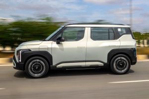 Driving: Side Profile (Left) View Image of Syros EV