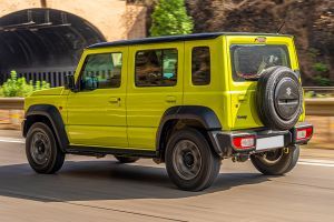 Driving: Rear Left Three Quarter View Image of Jimny