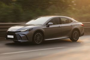 Driving: Front Left Quarter View Image of Camry