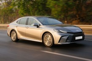Driving: Front Right Quarter View Image of Camry