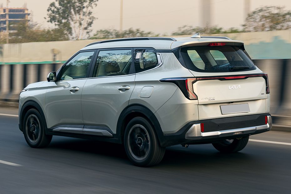 Driving: Rear Left Three Quarter View Image of Carens Clavis