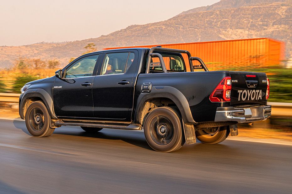 Driving: Rear Left Three Quarter View Image of Hilux