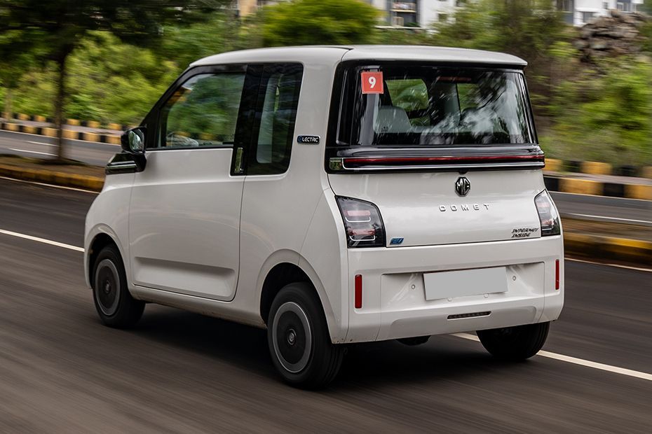 Driving: Rear Left Three Quarter View Image of Comet EV