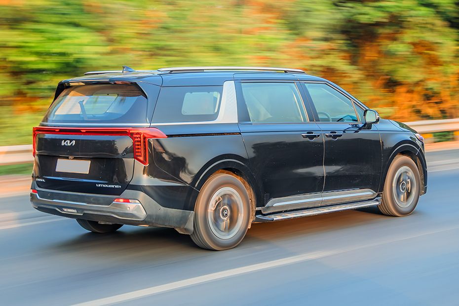 Driving: Rear Right Three Quarter View Image of Carnival