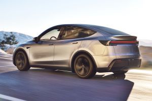 Driving: Rear Left Three Quarter View Image of Model Y