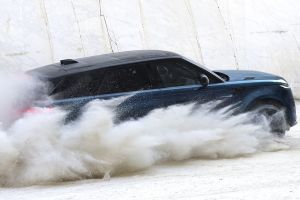 Driving: Rear Right Three Quarter View Image of Range Rover Sport Electric