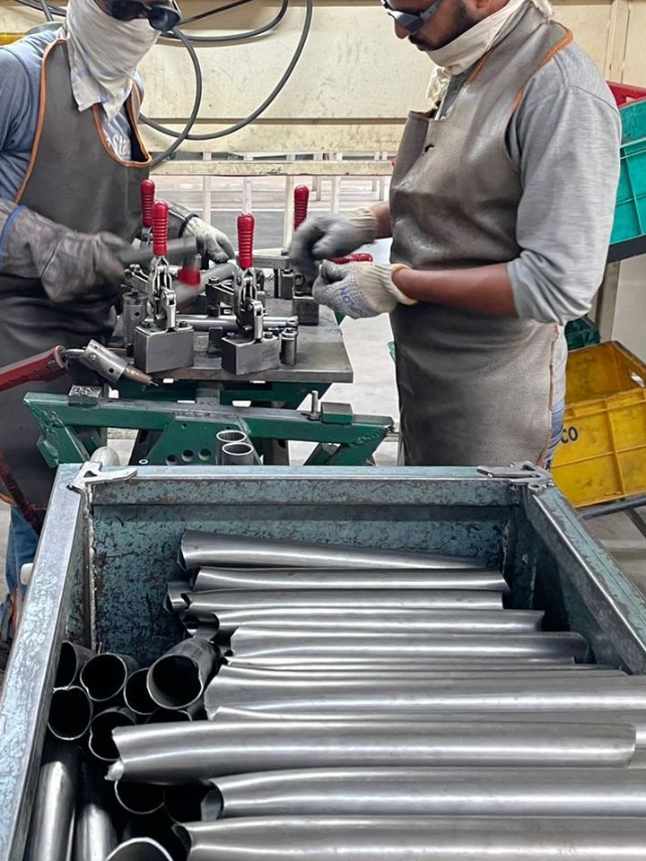 Steel or Aluminium is cut into rods to prepare the frame