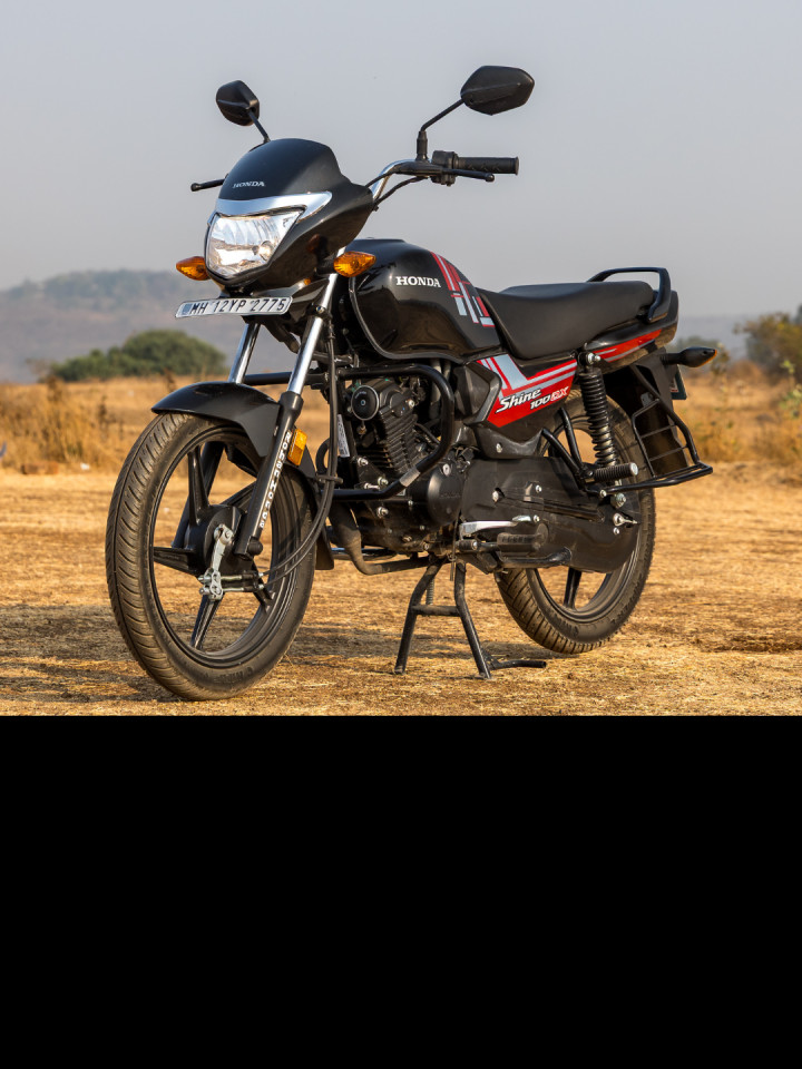 The DX builds on the standard Shine 100 with practical upgrades that make daily commuting feel more premium